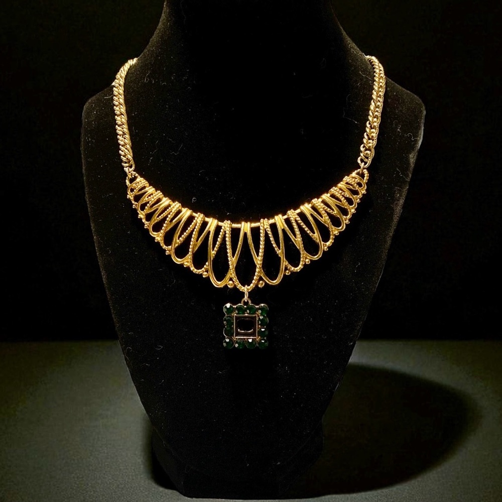 Avon gold tone necklace up cycled with a green rhinestone charm.